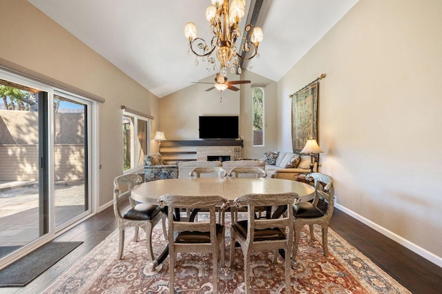 dining area featuring lofted ceiling, hardwood / wood-style floors, and a wealth of natural light