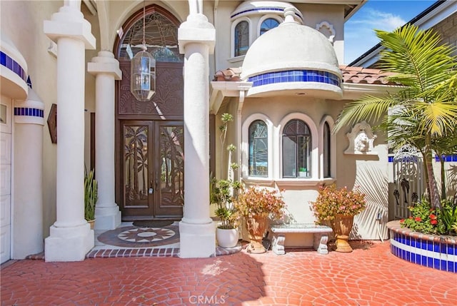 property entrance featuring french doors