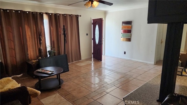 living room featuring light tile patterned floors, ceiling fan, and crown molding