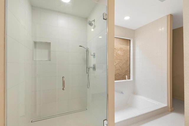 bathroom featuring an enclosed shower