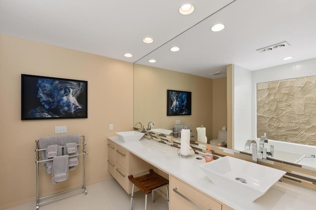 bathroom featuring tile patterned floors, vanity, and toilet