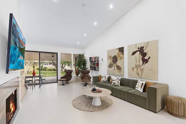 living room with high vaulted ceiling