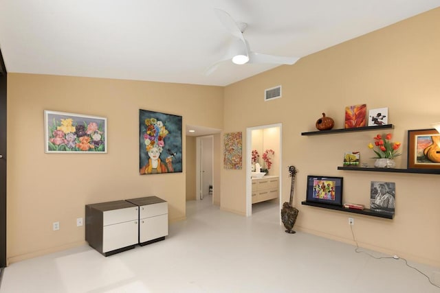 interior space with ceiling fan and lofted ceiling