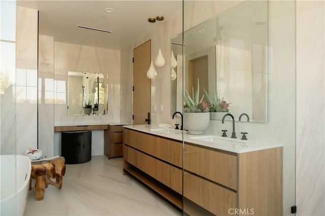 bathroom with tasteful backsplash and vanity