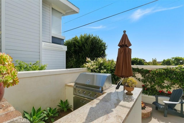 view of patio / terrace featuring area for grilling and exterior kitchen