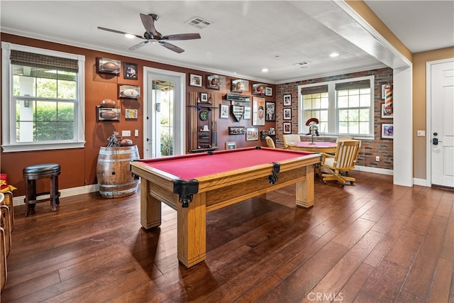 playroom featuring ceiling fan, ornamental molding, brick wall, billiards, and dark hardwood / wood-style flooring