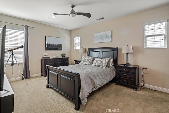 bedroom featuring ceiling fan and light colored carpet