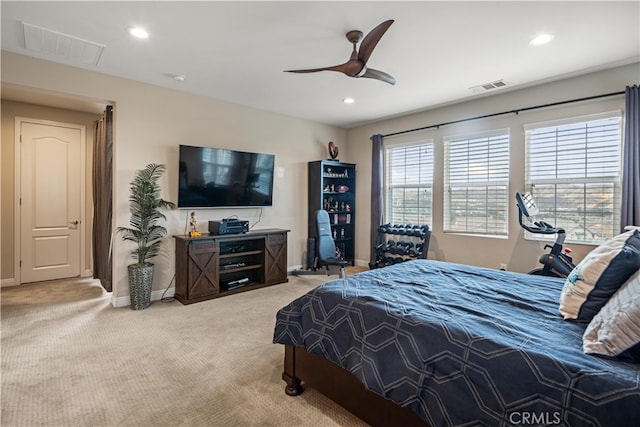 bedroom featuring light carpet and ceiling fan