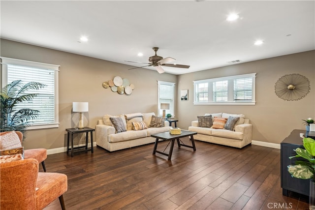 living room with dark hardwood / wood-style floors and ceiling fan