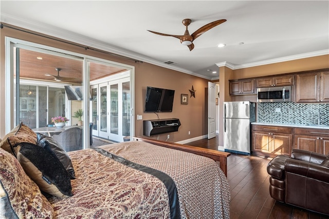 bedroom featuring access to outside, stainless steel refrigerator, dark hardwood / wood-style flooring, ornamental molding, and ceiling fan