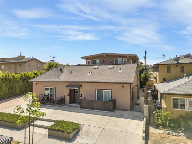 rear view of house with a patio area