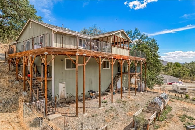 back of property with a wooden deck