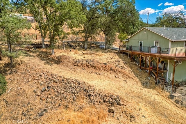 view of yard featuring a wooden deck