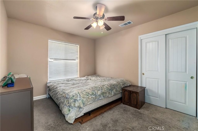 bedroom featuring ceiling fan, carpet flooring, and a closet