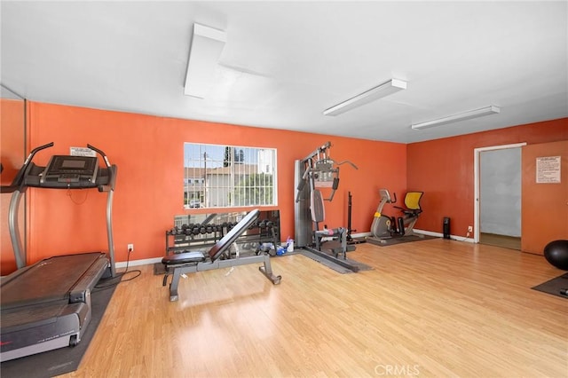 exercise area featuring hardwood / wood-style flooring