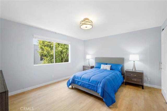 bedroom with light wood-type flooring