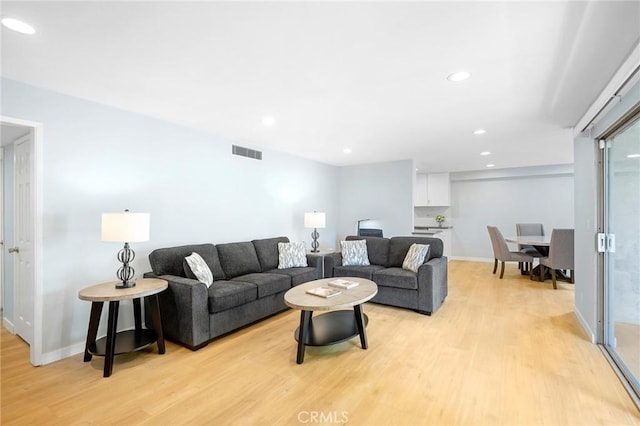 living room with light hardwood / wood-style floors