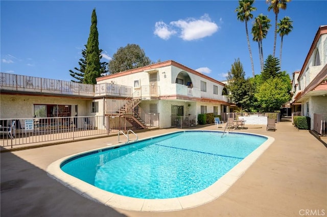 view of swimming pool featuring a patio