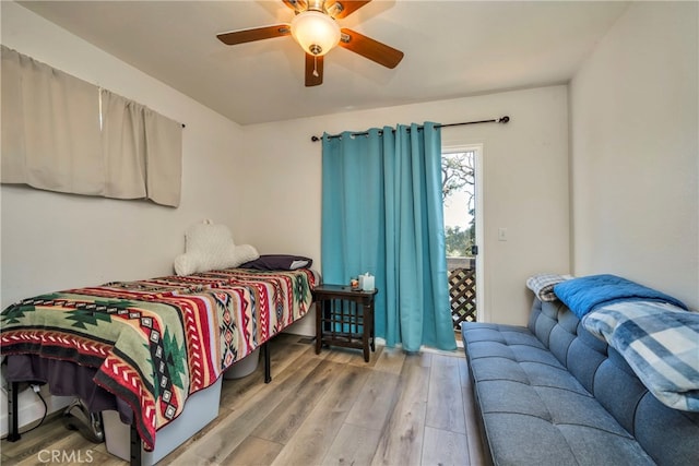 bedroom featuring ceiling fan and light hardwood / wood-style flooring