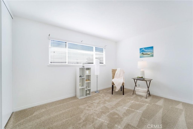 unfurnished room with light colored carpet