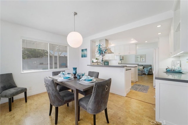 dining area featuring light wood-type flooring