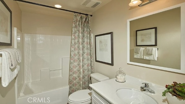 full bathroom with vanity, toilet, and shower / bath combination with curtain