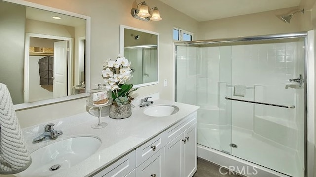 bathroom with vanity and an enclosed shower