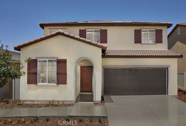 mediterranean / spanish-style house featuring a garage