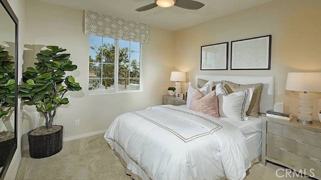 bedroom featuring ceiling fan and light carpet