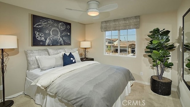 bedroom featuring ceiling fan and light colored carpet