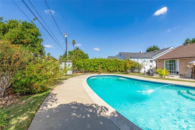 view of swimming pool featuring a patio area