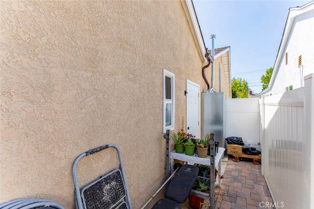 view of side of home featuring a patio area