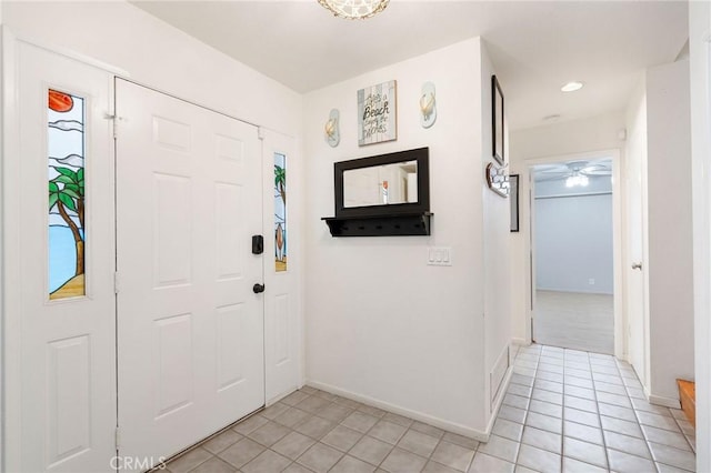 entrance foyer featuring light tile patterned floors