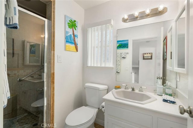 bathroom featuring vanity, toilet, and walk in shower