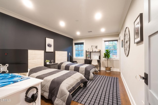 bedroom featuring ornamental molding and hardwood / wood-style flooring