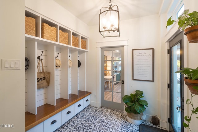 mudroom with a notable chandelier and a wealth of natural light