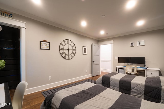 bedroom featuring dark hardwood / wood-style floors and crown molding