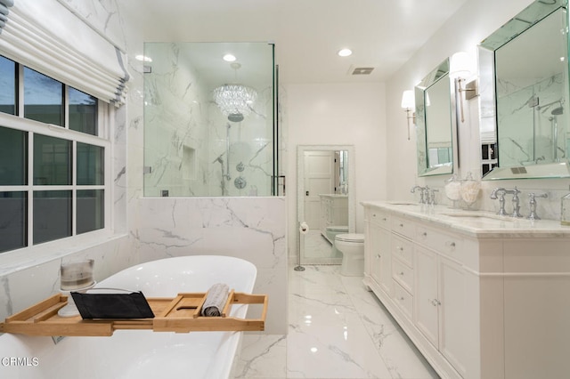 full bathroom with an inviting chandelier, separate shower and tub, vanity, and toilet