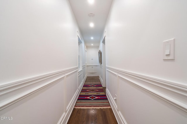 hall with dark hardwood / wood-style floors