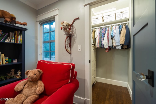 sitting room with dark hardwood / wood-style flooring