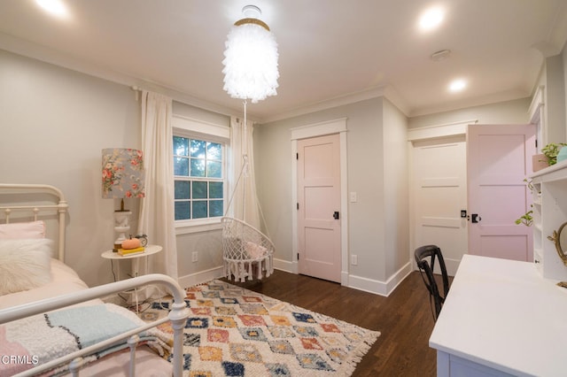 bedroom with crown molding and dark hardwood / wood-style flooring