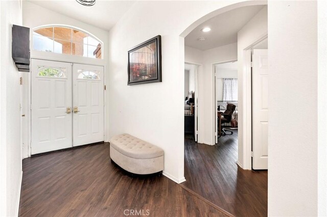 foyer entrance featuring dark hardwood / wood-style floors