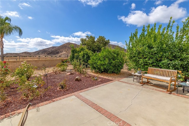 view of patio / terrace with a mountain view