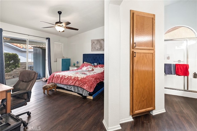 bedroom with multiple windows, access to outside, ceiling fan, and dark wood-type flooring