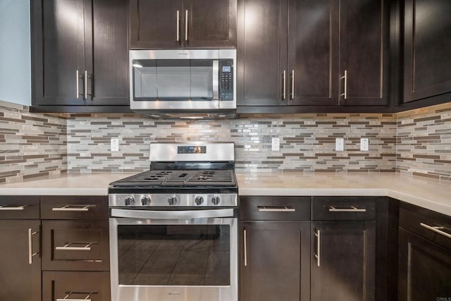 kitchen with dark brown cabinetry, stainless steel appliances, and tasteful backsplash