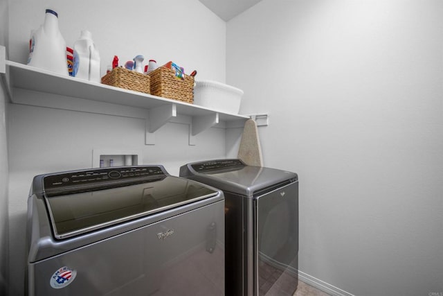 laundry room with separate washer and dryer