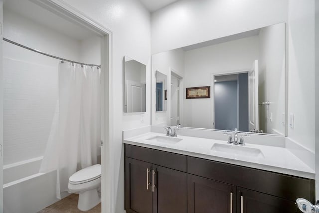 full bathroom featuring vanity, tile patterned floors, toilet, and shower / bath combo