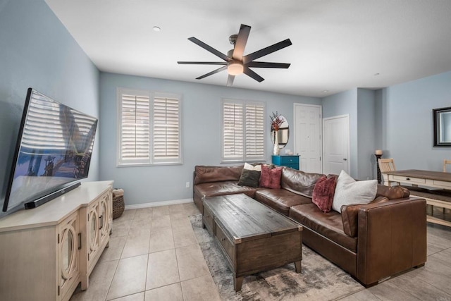 tiled living room with ceiling fan