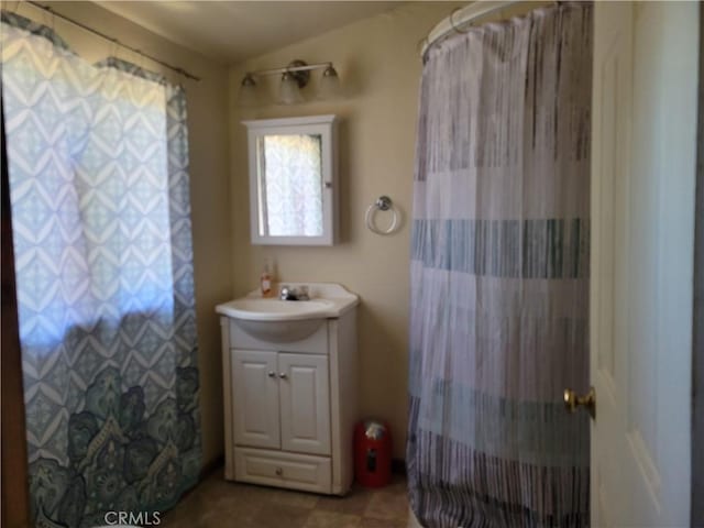 bathroom with vanity and walk in shower