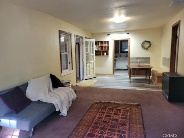 living room featuring light colored carpet